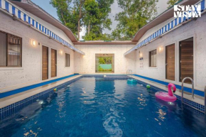 Sundream Palms by VEO - Part of StayVista with Pool, Lawn, BBQ